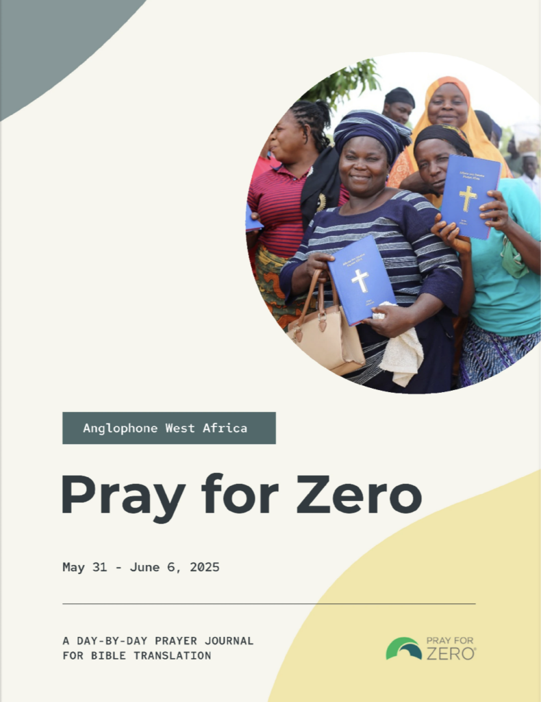 Group of women in West Africa joyfully holding translated Bibles during a Pray for Zero Bible translation event